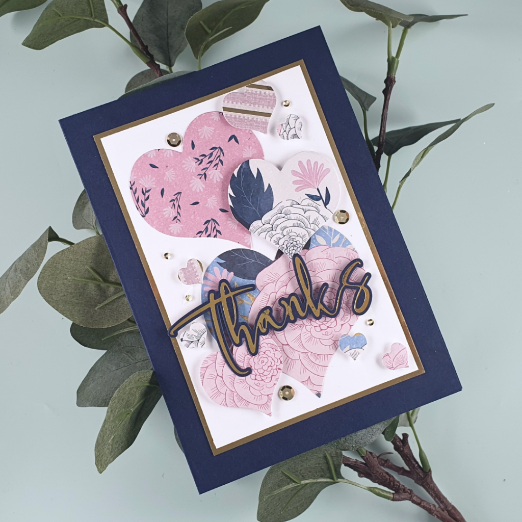 Handmade Thank You Card Created using Patterned Paper and Layering Hearts Dies